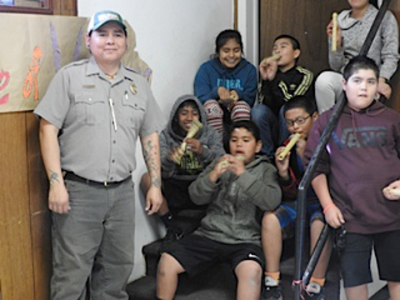 Marlon Magdalena and students with flutes