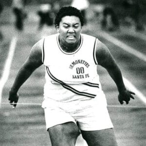 Carla Garrett crossing the finishing line