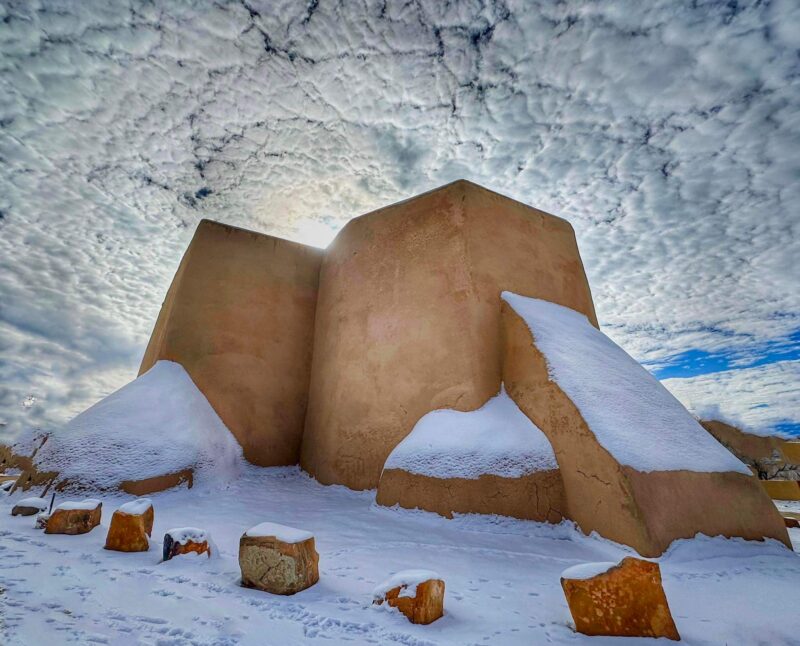 Photo of the San Francisco de Asis Catholic Mission Church in snow