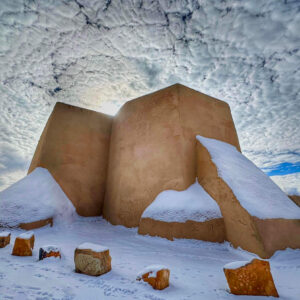 Photo of the San Francisco de Asis Catholic Mission Church in snow