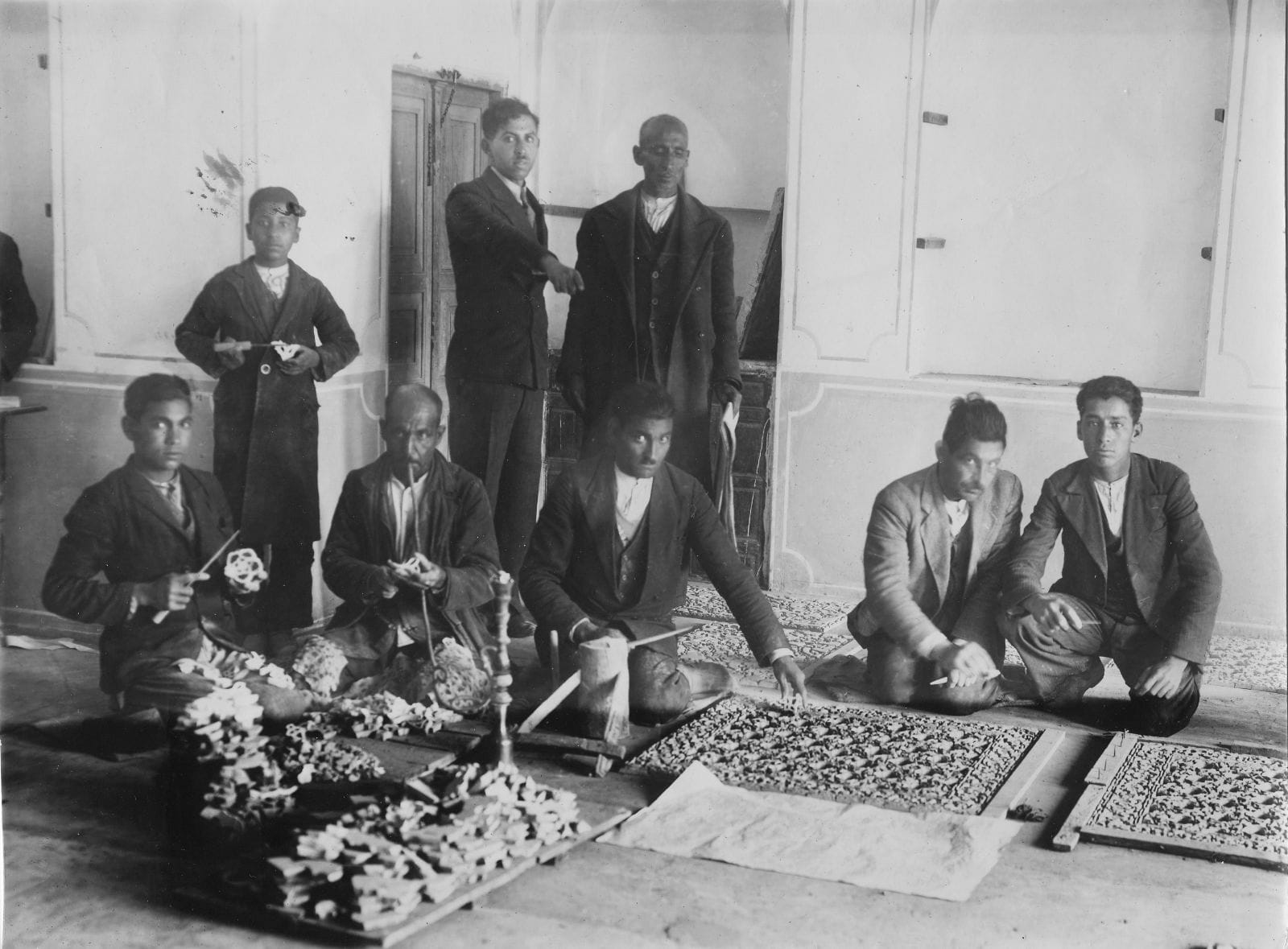 Photo of Craftsmen installing tiles at Shangri La, Hawaii