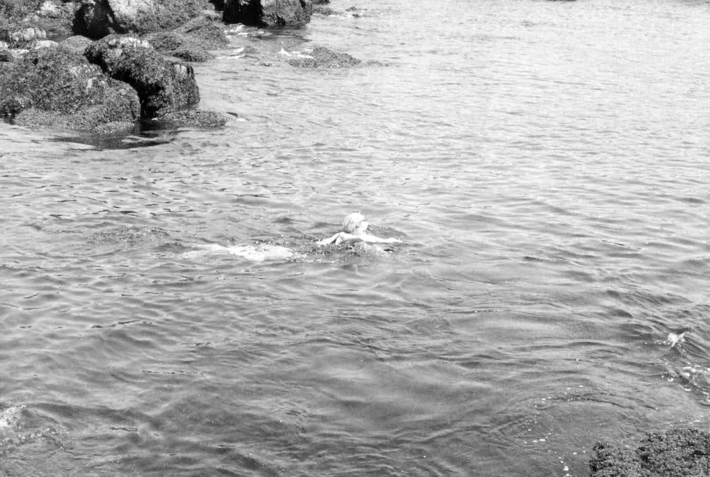 Photo of Doris Duke swimming in the ocean