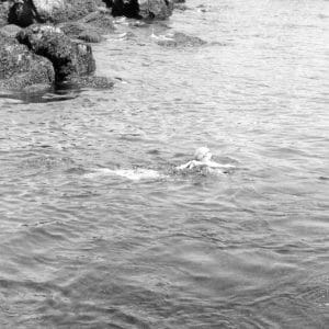 Photo of Doris Duke swimming in the ocean