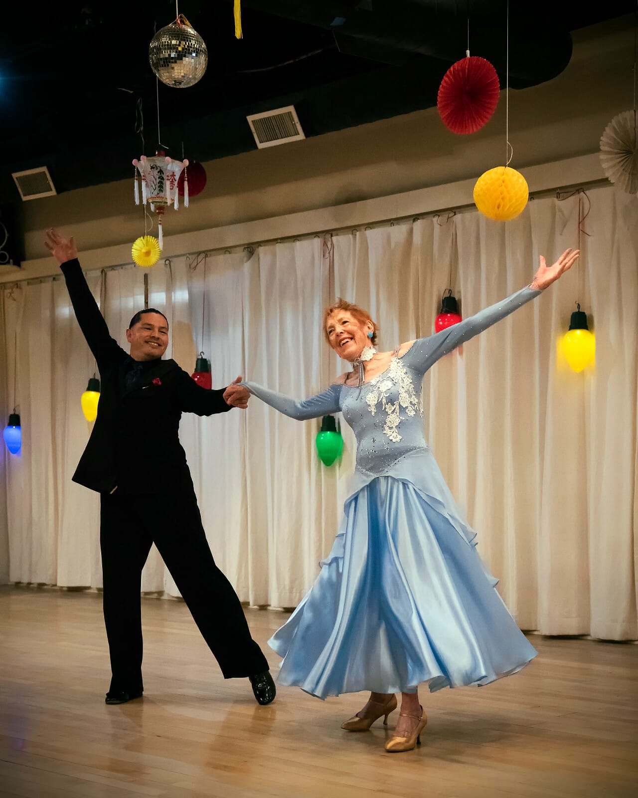 Sallie ballroom dancing with instructor