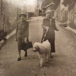 Photo of Gertrude Stein and Alice B. Toklas with dog