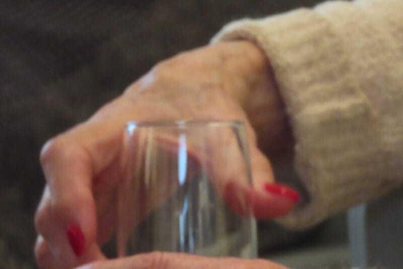 Photo of a woman's hands holding a wine glass