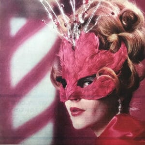 Photo of a woman wearing a pink extravagant mask matching her lipstick