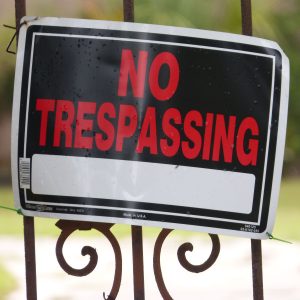 Photo of No Trespassing sign on gate