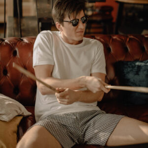 Man in underwear playing air drums