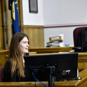 Photo of young woman testifying in court
