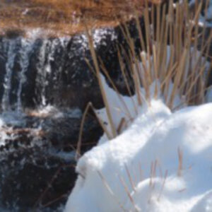 Photo of spring waterfall with snow
