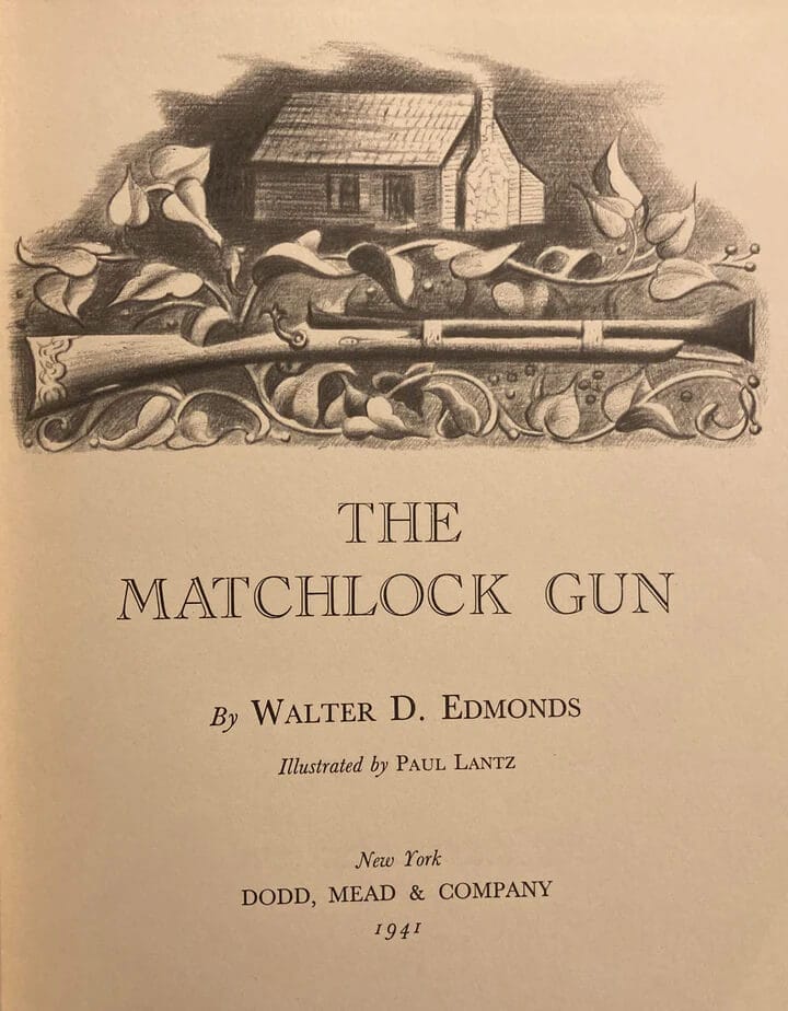 Photo of a gun and house surrounded by flowers