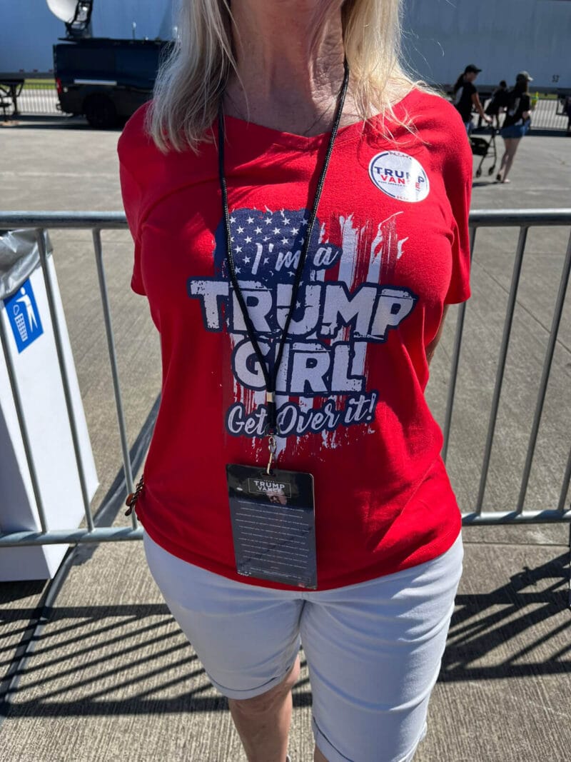 Photo of woman wearing t-shirt that says "I'm a Trump Girl Get Over It!"